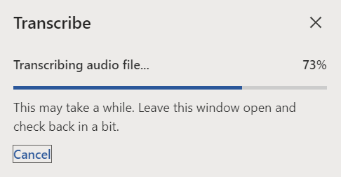 The following text is shown in the Transcribe view: "This may take a while. Leave this window open and check back in a bit."